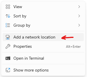 Windows 11 right-click context menu in File Explorer showing 'Add a network location' option highlighted with a red arrow